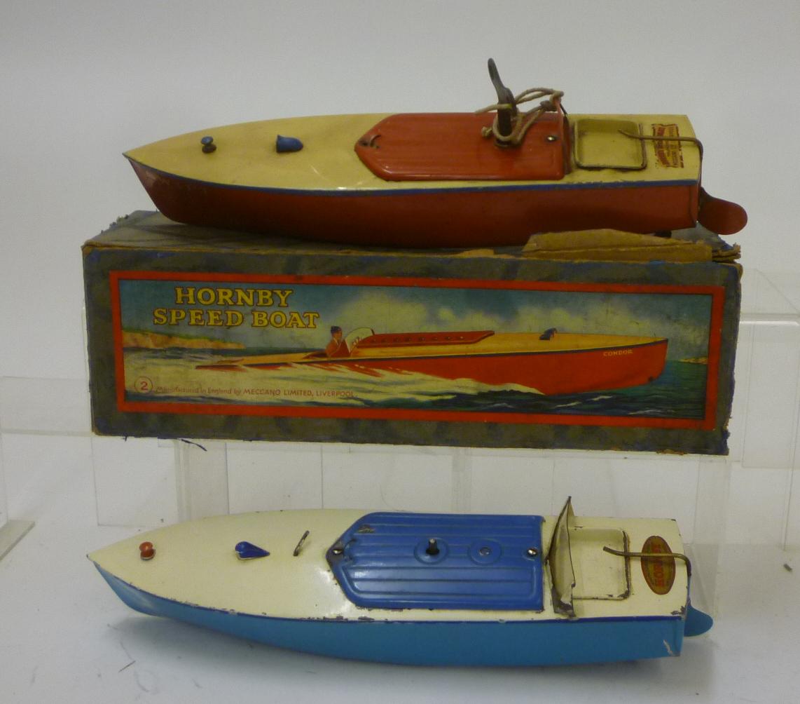 A Hornby No 2 Speedboat tinplate clockwork powered in cream and red Image