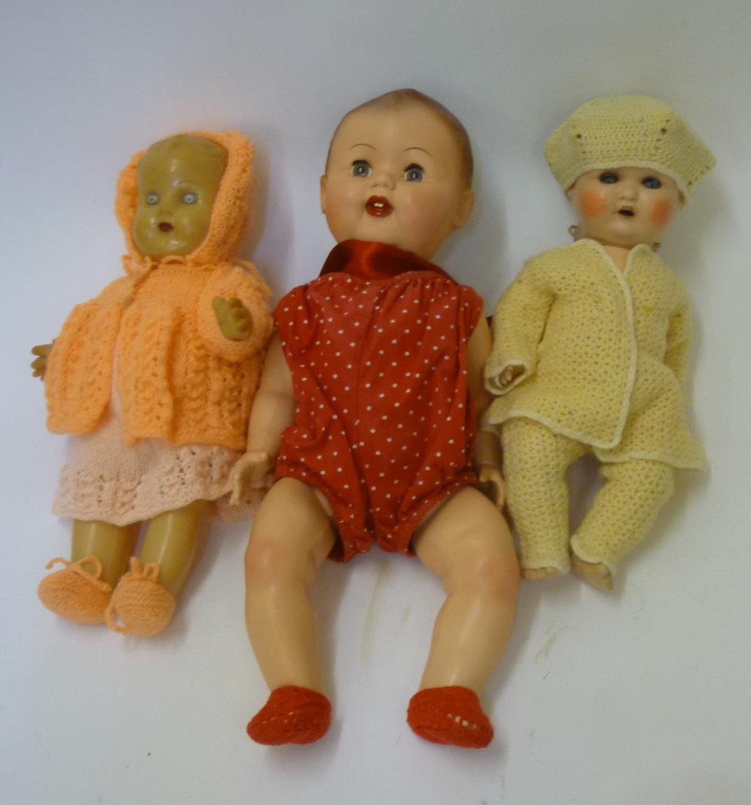 A composition doll with blue glass sleeping eyes Image