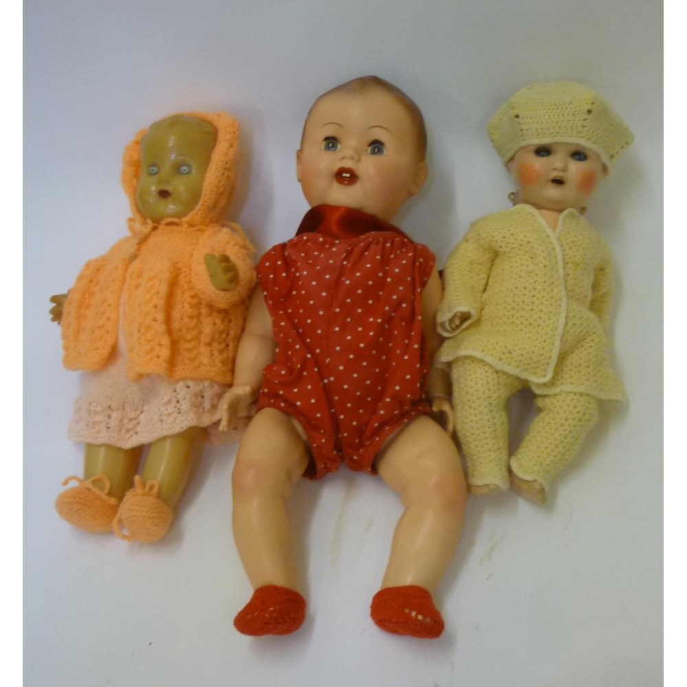 A composition doll with blue glass sleeping eyes Image