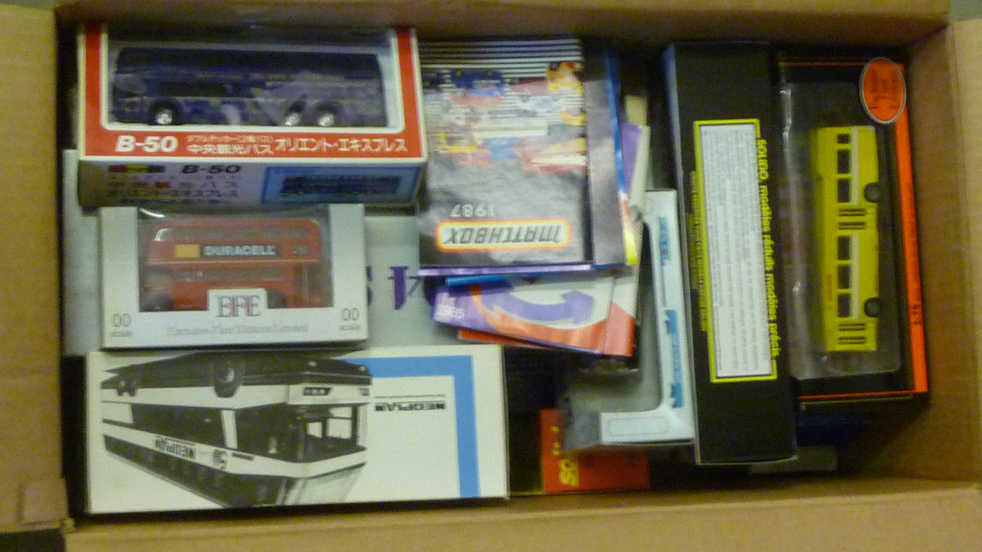 Six Siku bus models and twelve other bus models Image