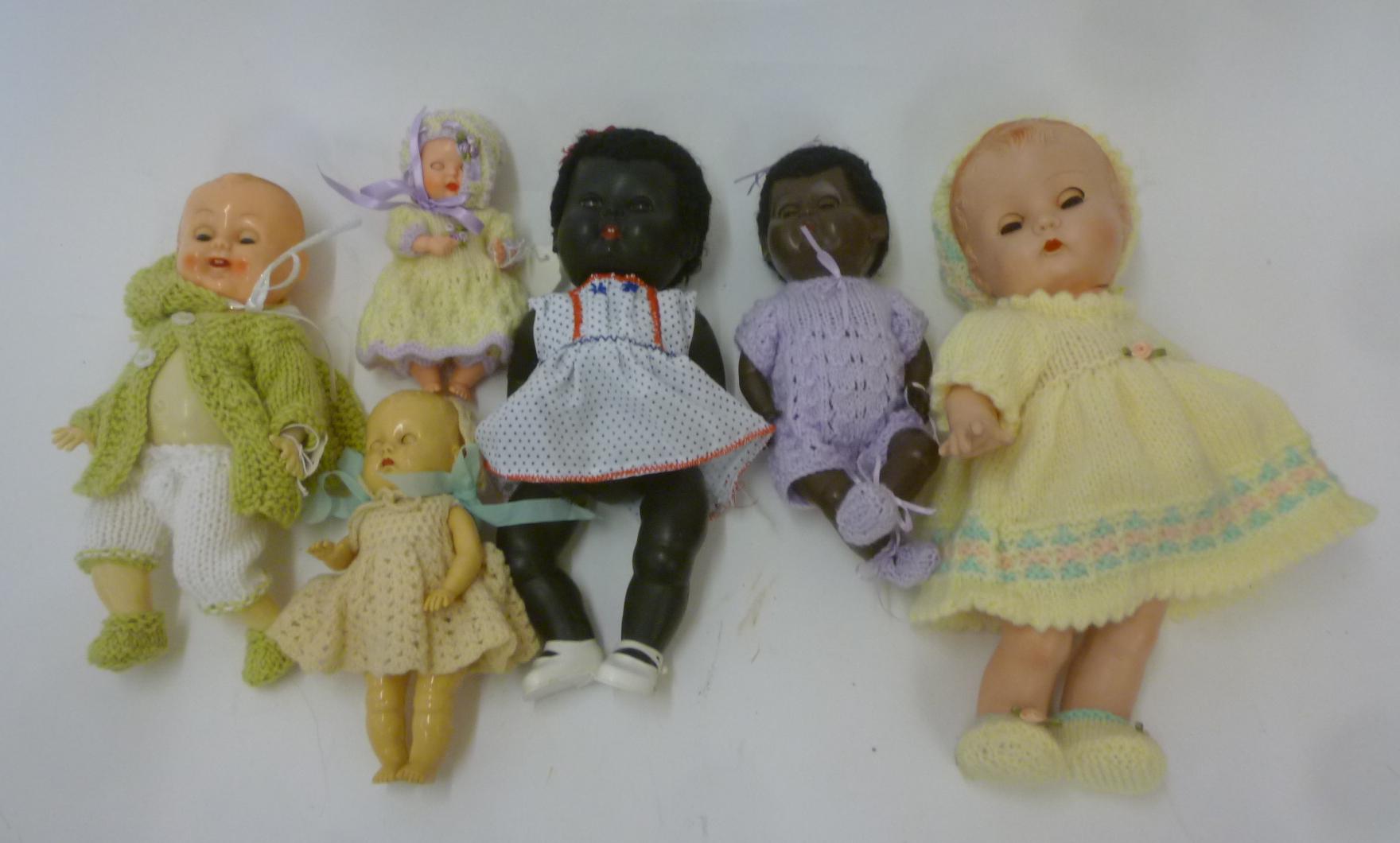 Three Rosebud plastic dolls including two black dolls Image
