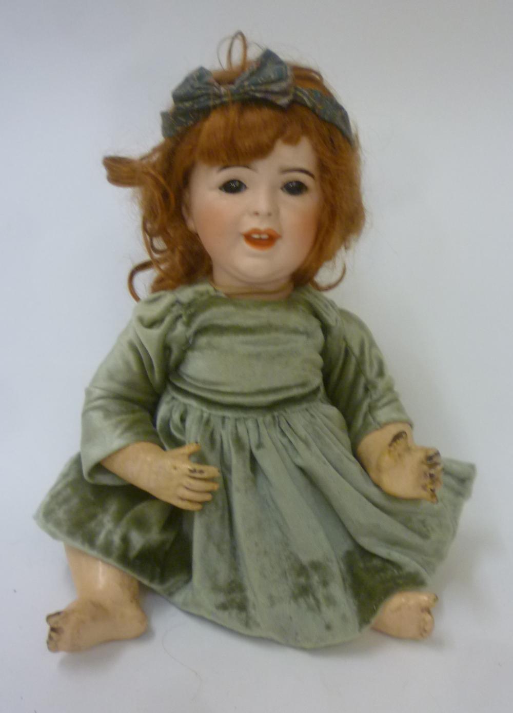 A French S.F.B.J. bisque head character doll with brown glass sleeping eyes Image