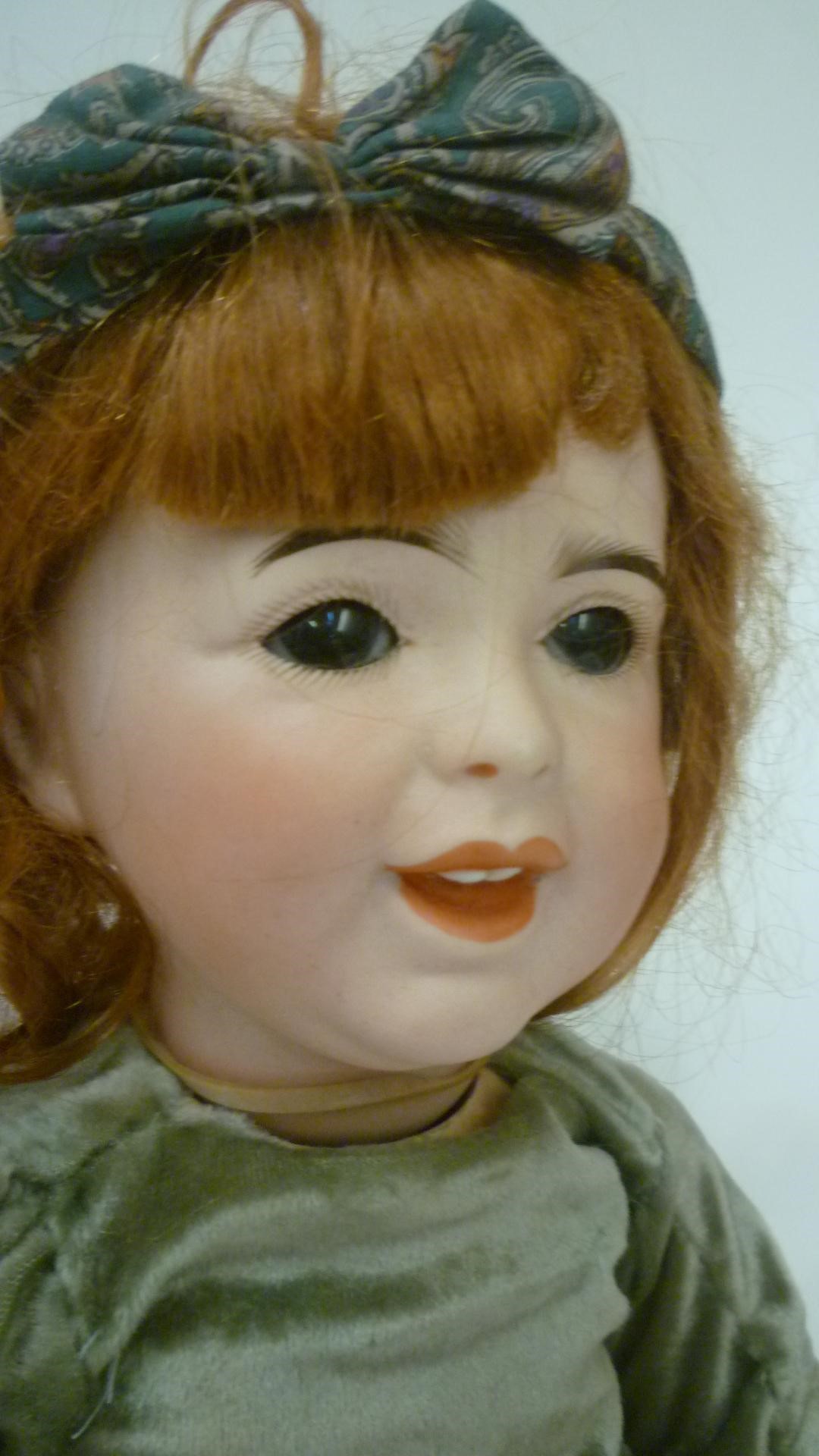 A French S.F.B.J. bisque head character doll with brown glass sleeping eyes Image
