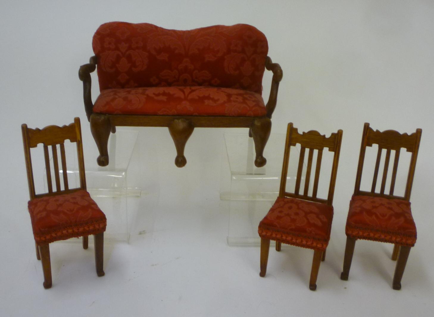 A suite of dolls' furniture in hardwood upholstered in red brocade Image