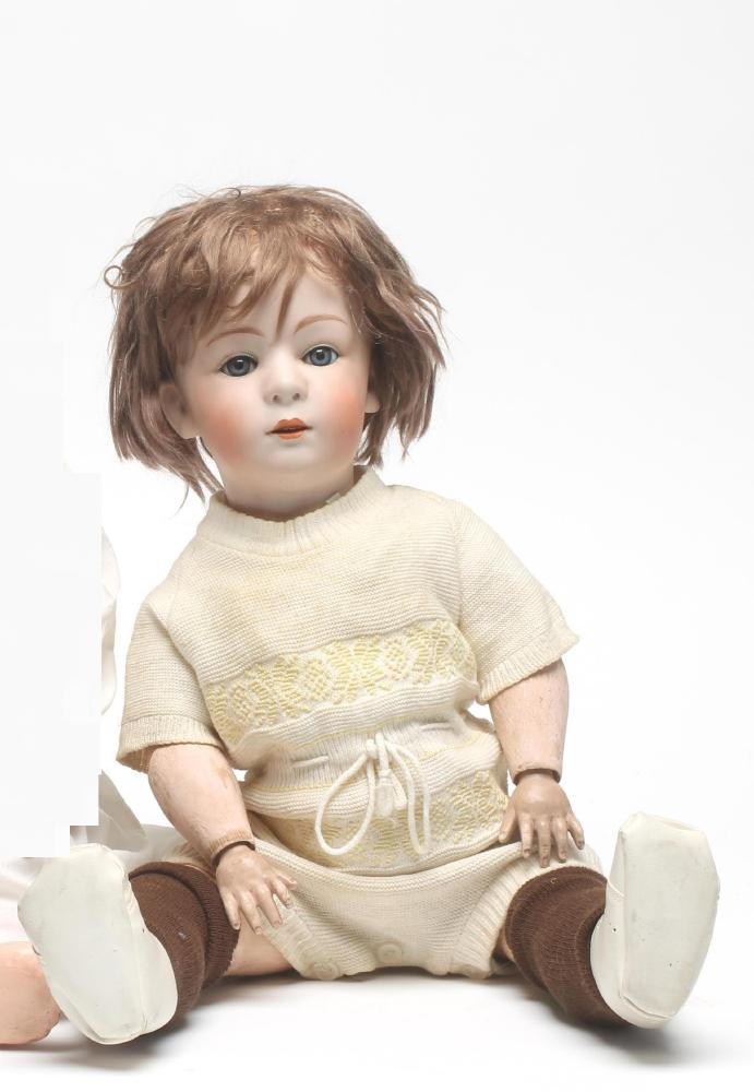 A Gebruder Heubach bisque head boy character doll with blue glass sleeping eyes Image