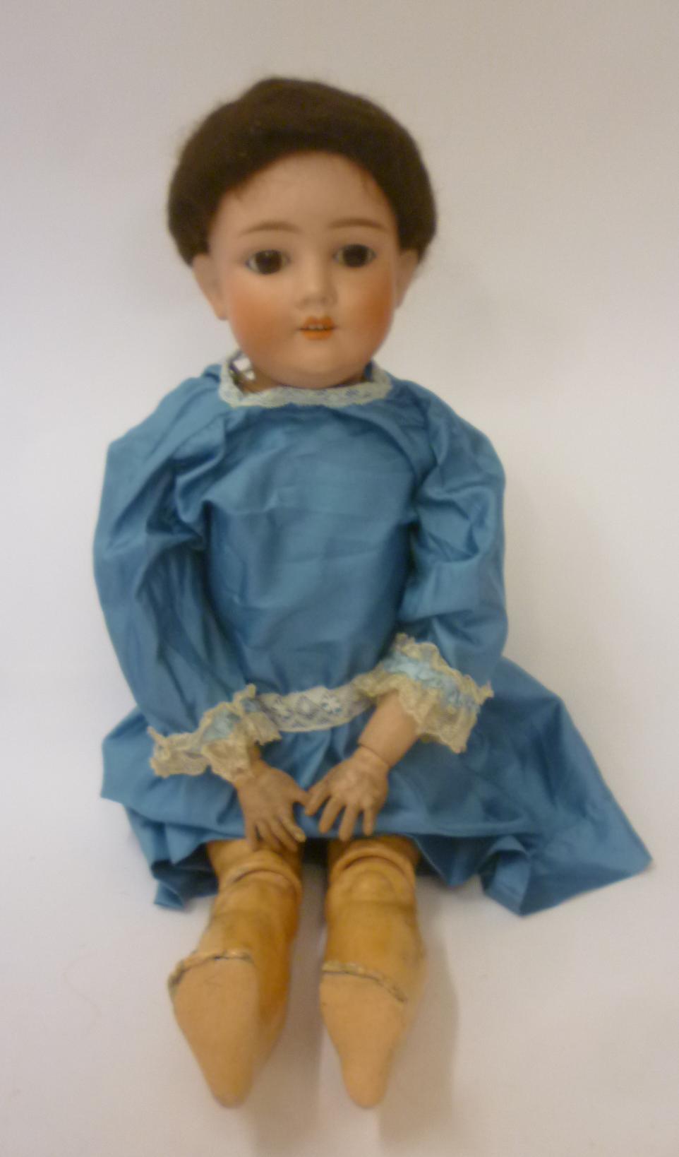 A German bisque head doll Image