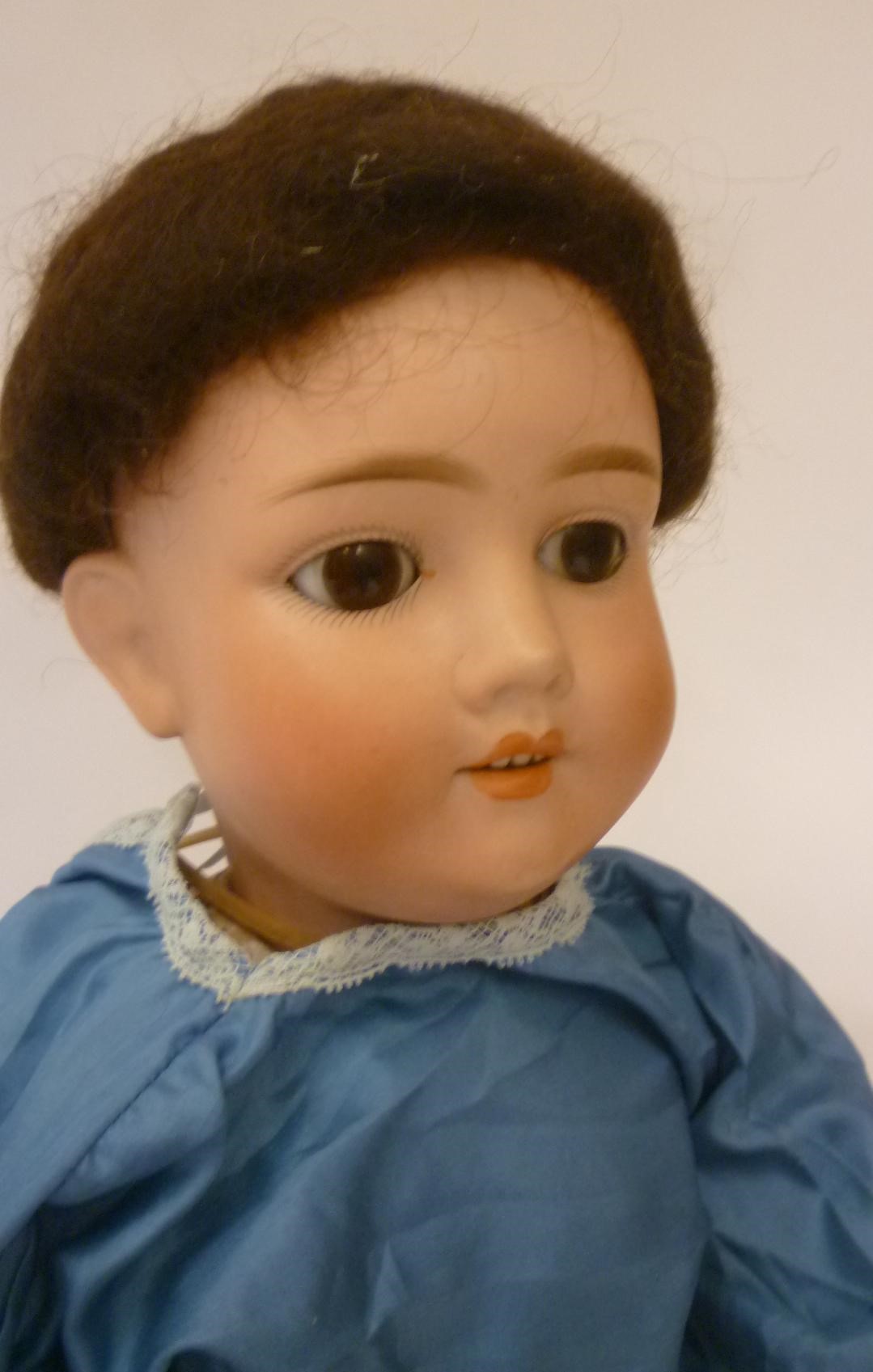 A German bisque head doll Image