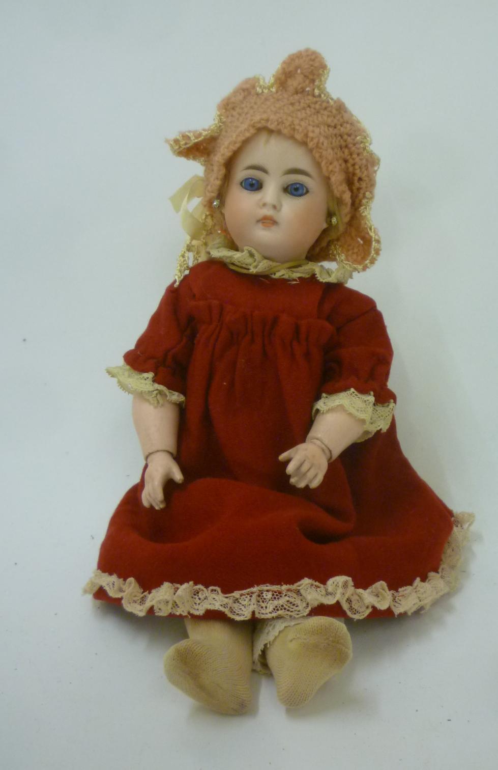 A Bahr & Proschild bisque head doll with fixed blue glass eyes Image