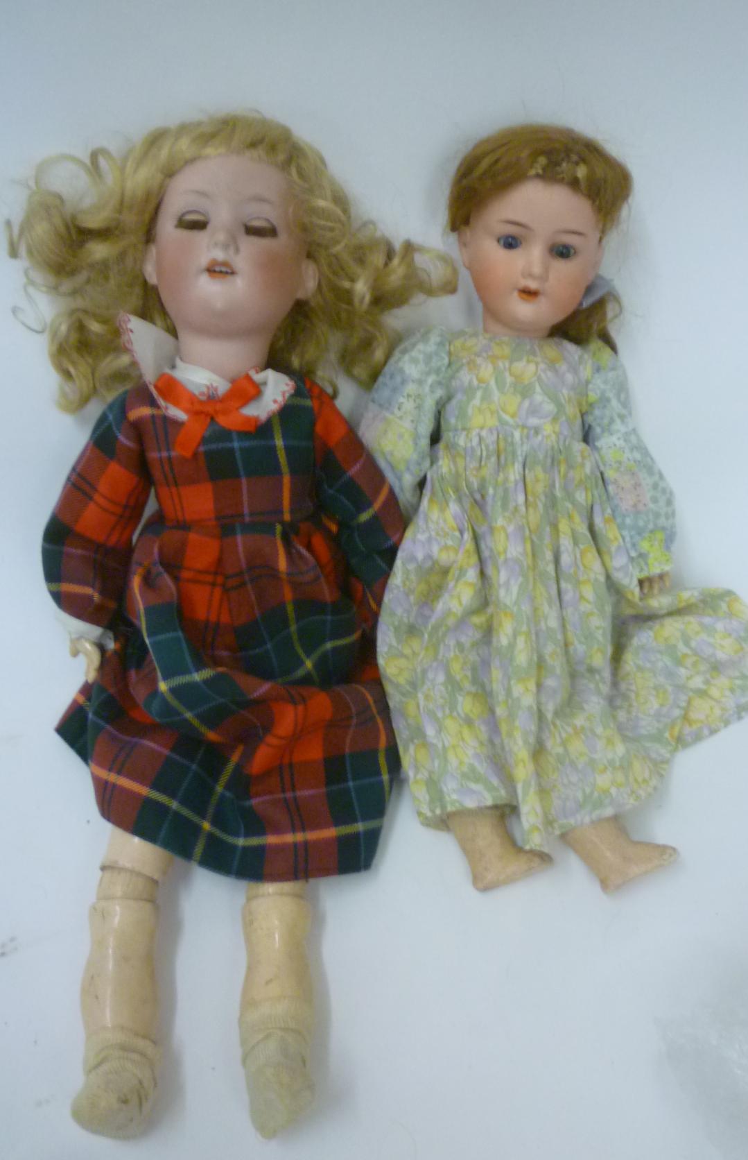 An Armand Marseille bisque head doll with brown glass sleeping eyes Image