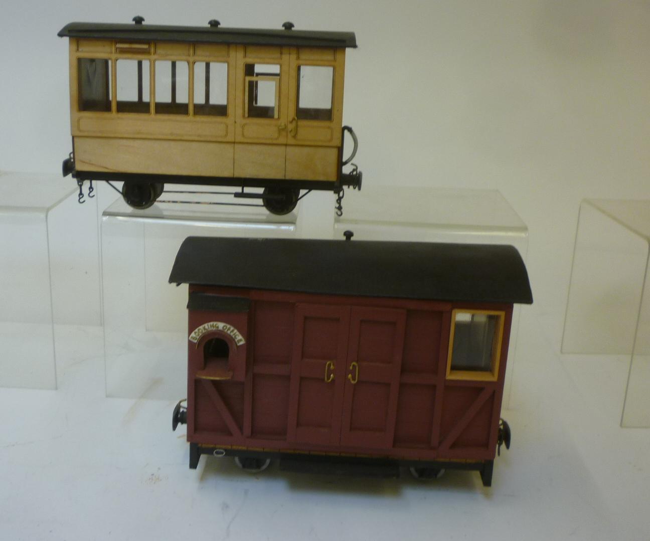 Handmade wooden passenger coach and a booking office van Image