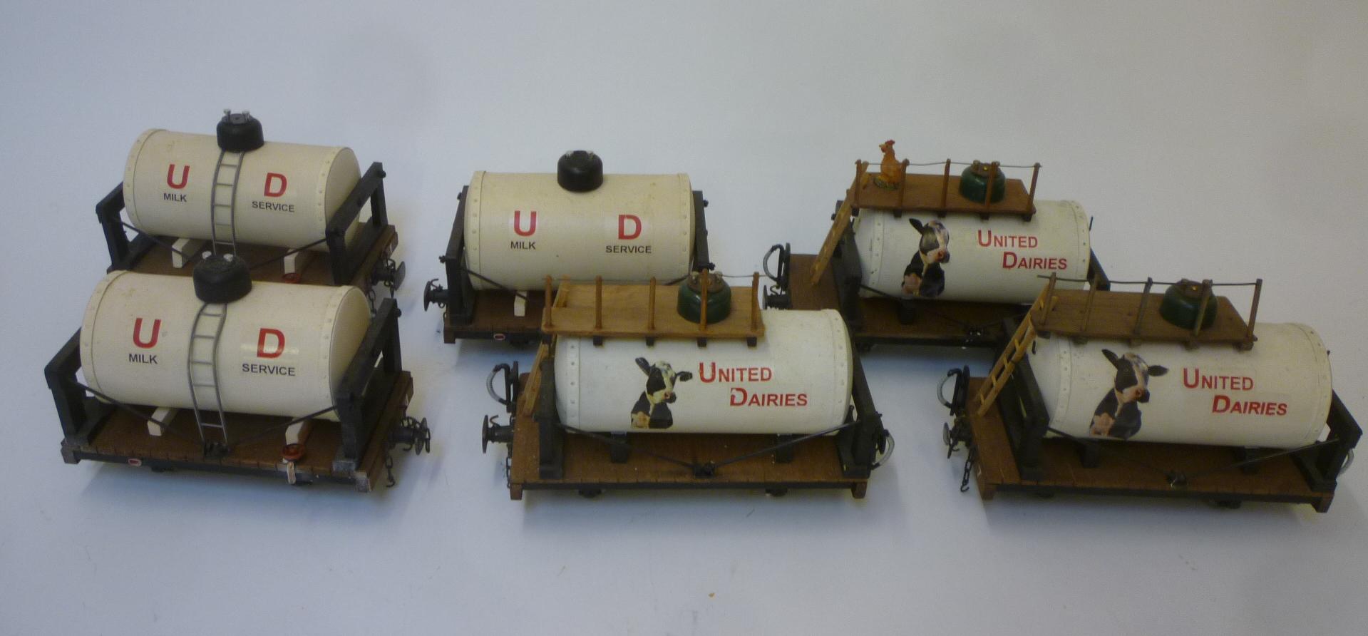 Six handmade four wheel United Dairies milk tankers finished in white with U.D. to tank sides Image