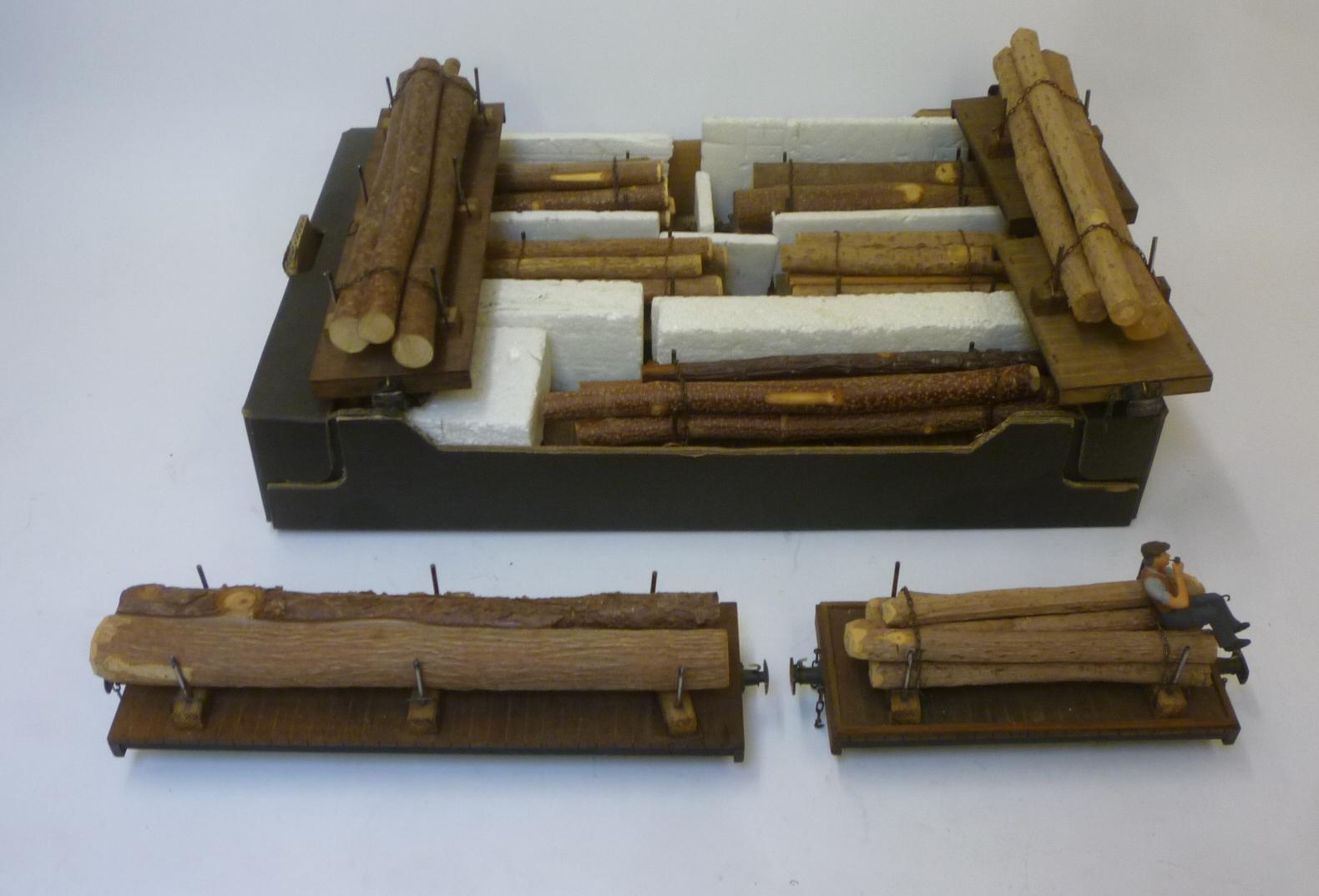 Nine bogie flat wagons with logs load and four wheel wagon with logs and workman load Image