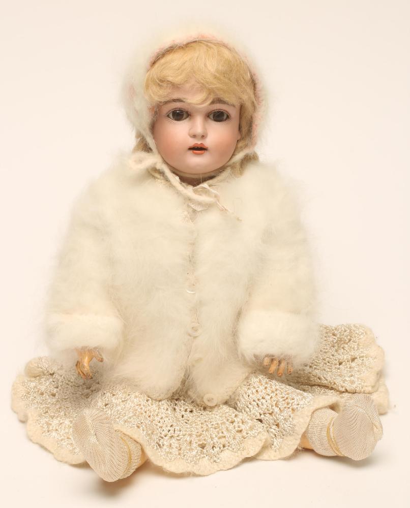 A Kestner bisque head doll with brown glass sleeping eyes Image