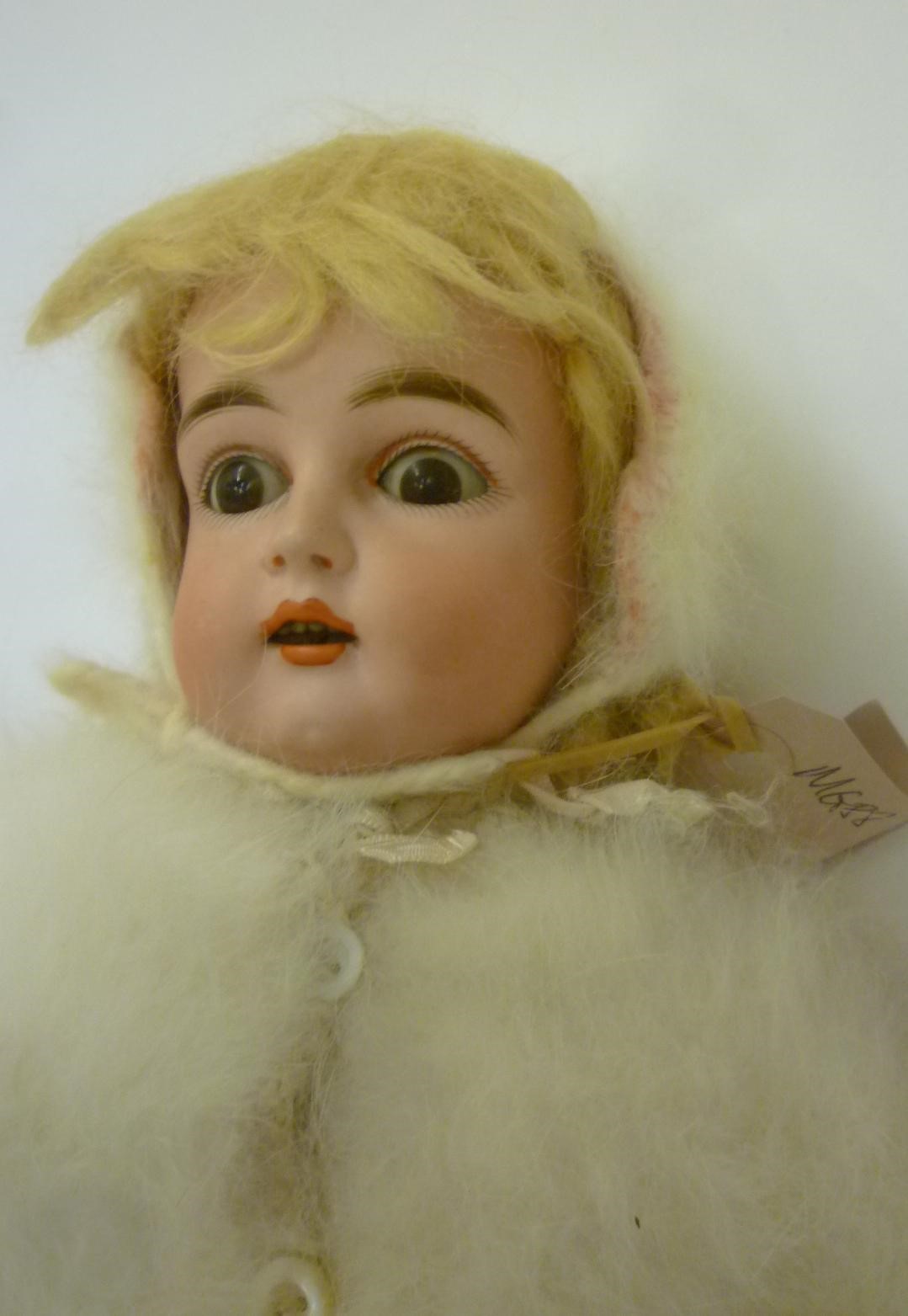A Kestner bisque head doll with brown glass sleeping eyes Image