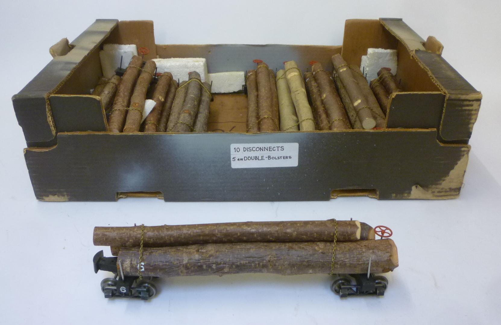 Ten American type bogie logging trucks with logs load Image