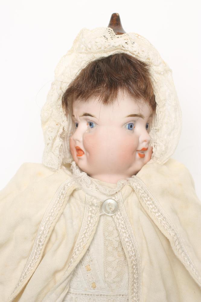 A German bisque head "Three Faces" doll with fixed blue glass eyes Image