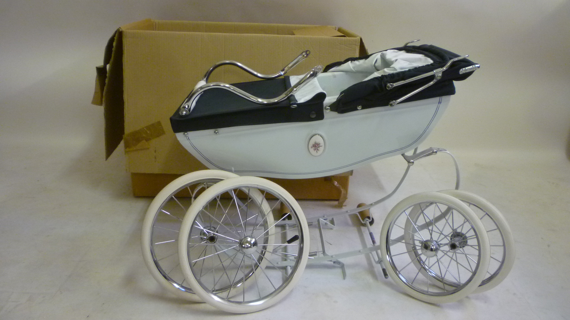 A Silver Cross coach built baby carriage Image
