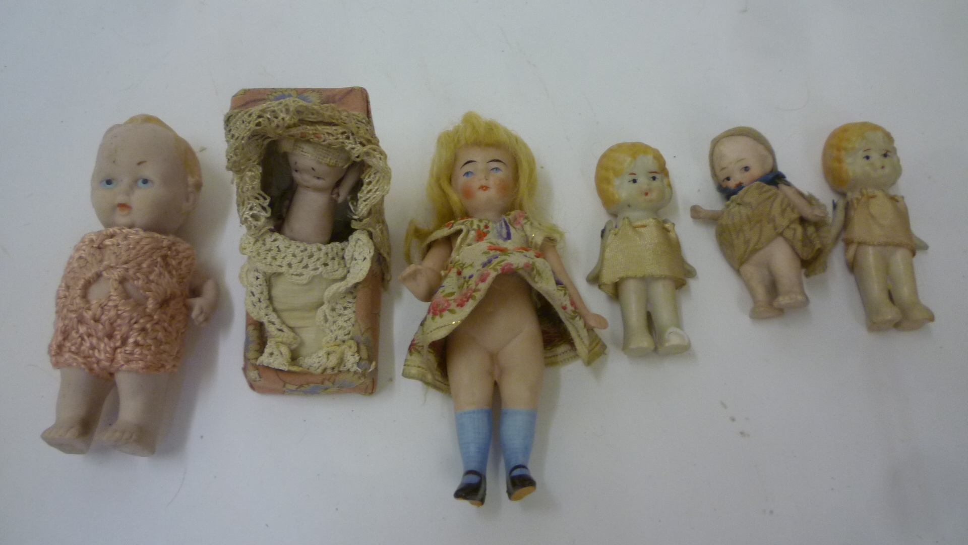 An all bisque dolls house doll with blonde mohair wig and swivel arms Image