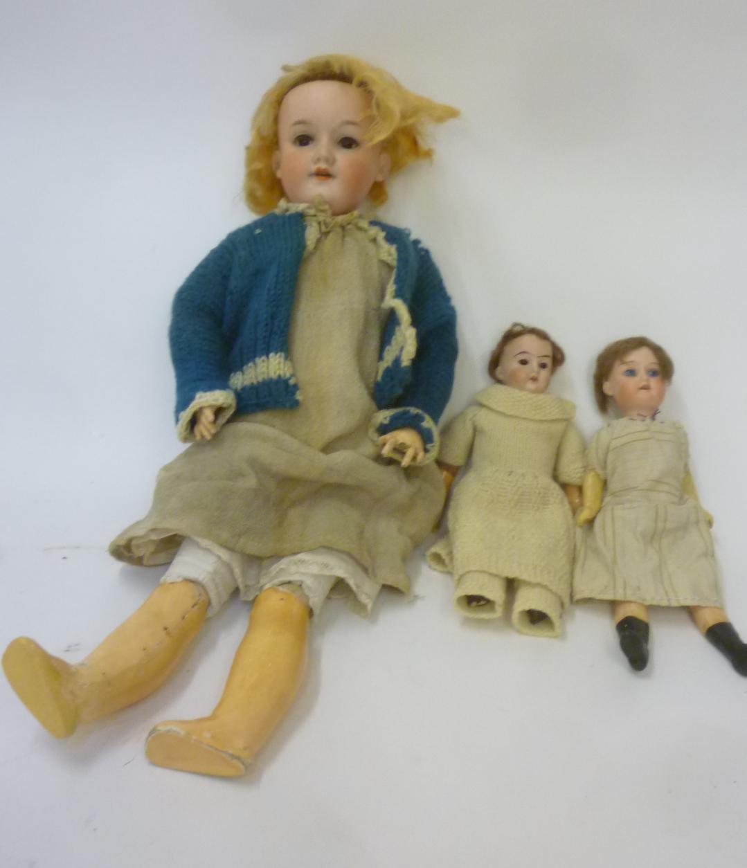 An Armand Marseille bisque head doll with brown glass sleeping eyes Image