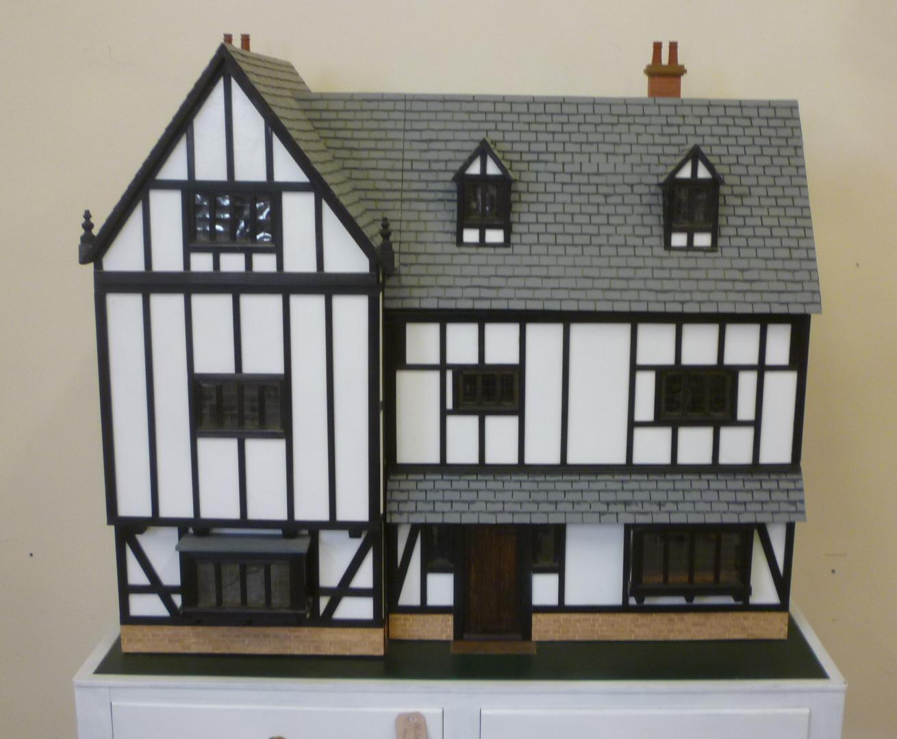 A cabinet made dolls house Image