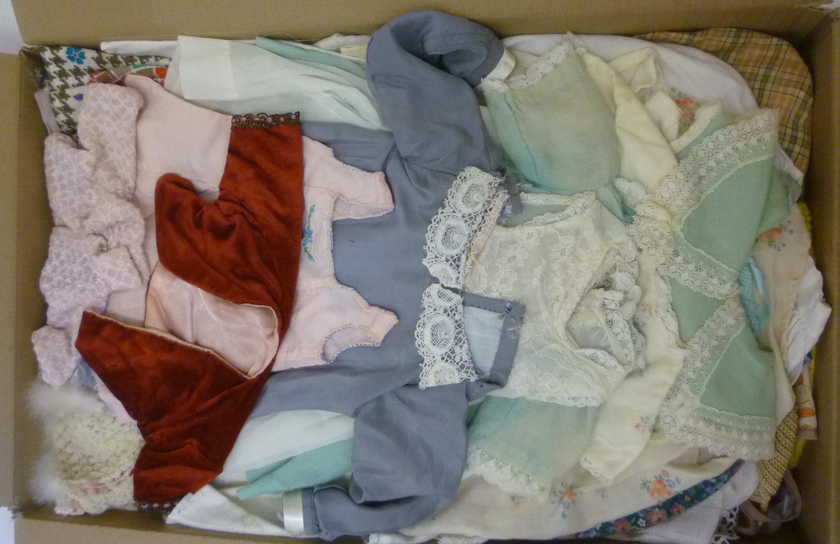 A quantity of dolls clothing including a christening gown Image