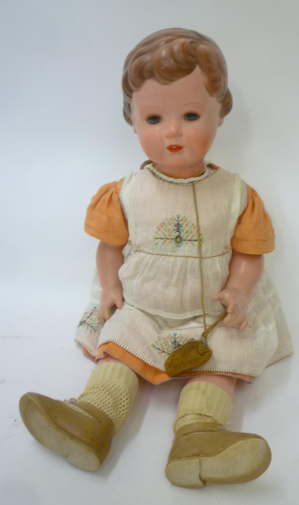 A Rheinische Gummi celluloid doll with blue glass sleeping eyes Image