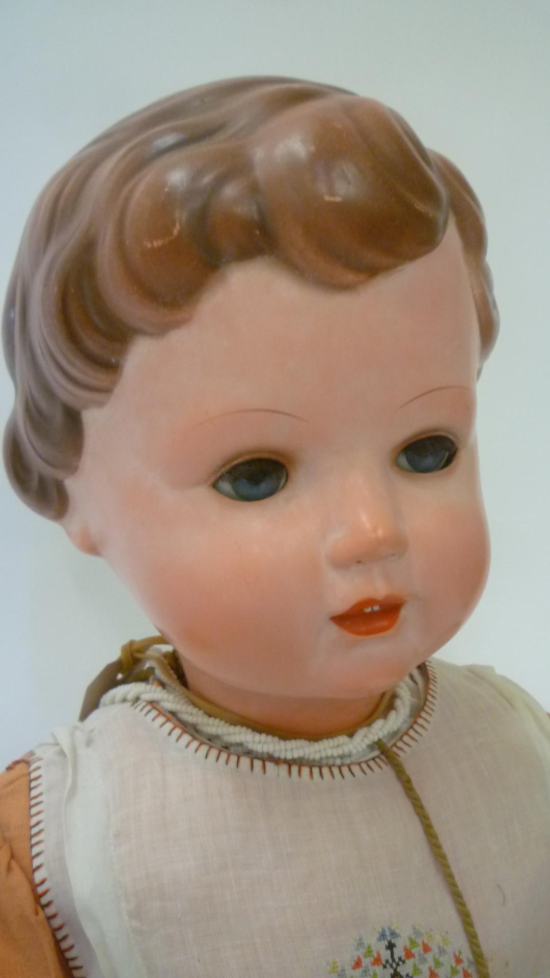 A Rheinische Gummi celluloid doll with blue glass sleeping eyes Image