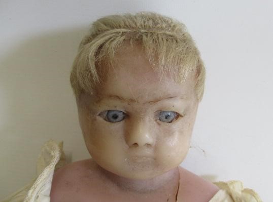 A wax shoulder head doll Image