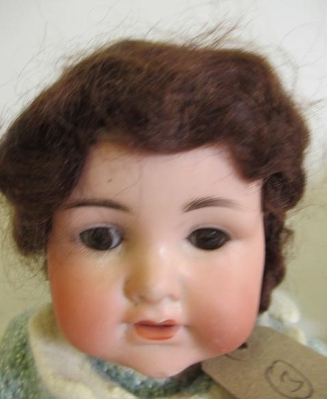 Three Armand Marseille bisque head dolls Image