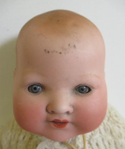 Three Armand Marseille bisque head dolls Image