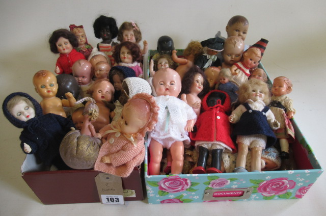 Two boxes of celluloid dolls Image