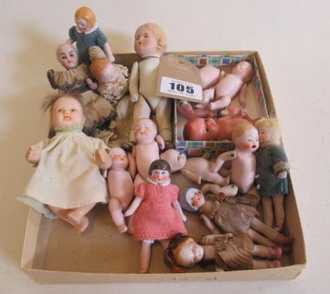 Sixteen jointed all bisque dolls house dolls Image