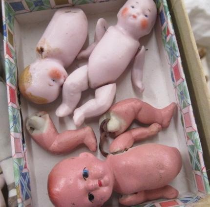 Sixteen jointed all bisque dolls house dolls Image