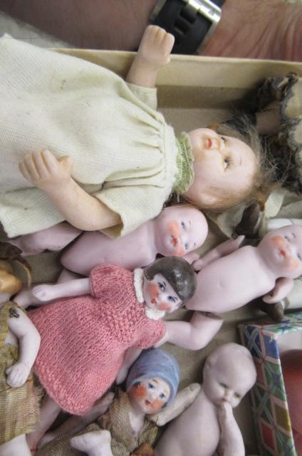 Sixteen jointed all bisque dolls house dolls Image