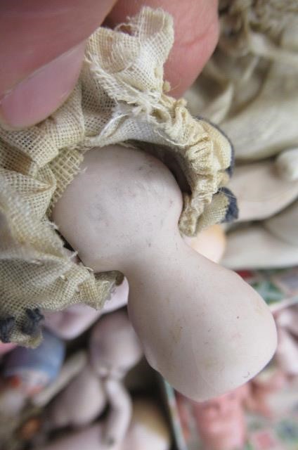 Sixteen jointed all bisque dolls house dolls Image