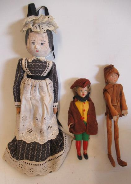 Three dolls comprising a circa 1900 10" wooden maid doll Image
