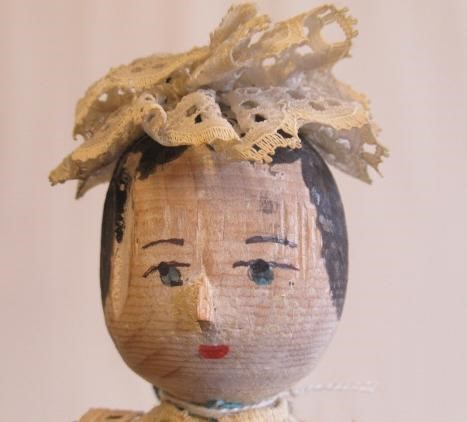 Three dolls comprising a circa 1900 10" wooden maid doll Image