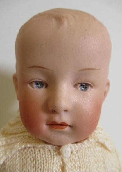 A Heubach solemn boy bisque socket head doll Image