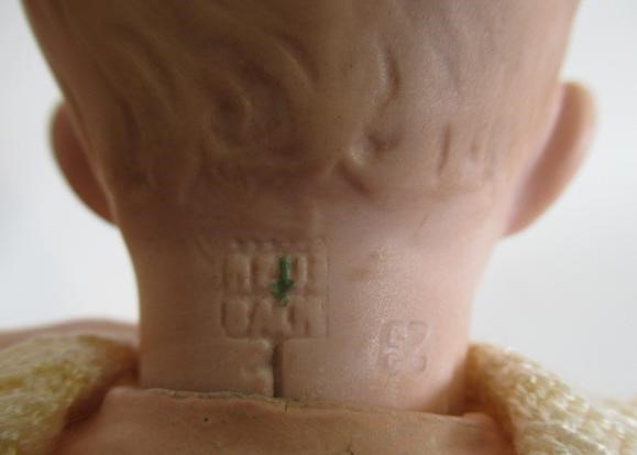 A Heubach solemn boy bisque socket head doll Image