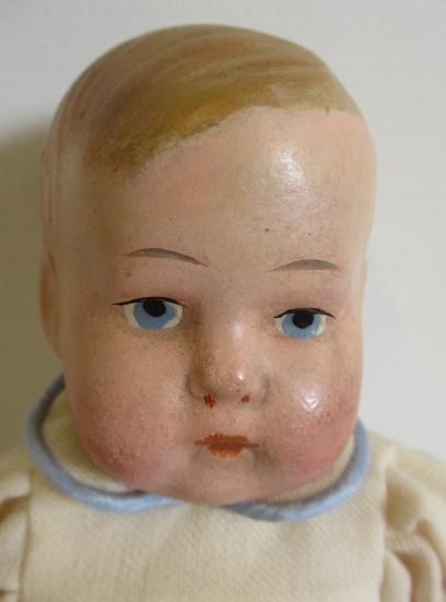 A Heubach solemn boy bisque socket head doll Image