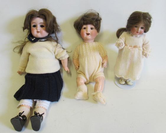 Three Armand Marseille bisque socket head dolls Image