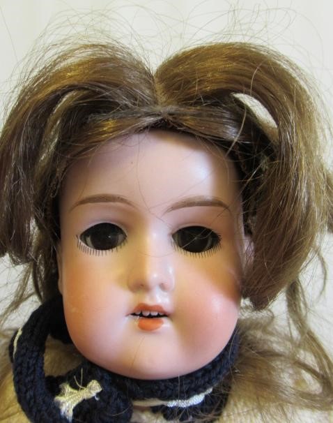 Three Armand Marseille bisque socket head dolls Image