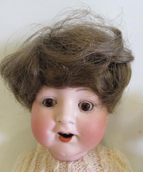 Three Armand Marseille bisque socket head dolls Image