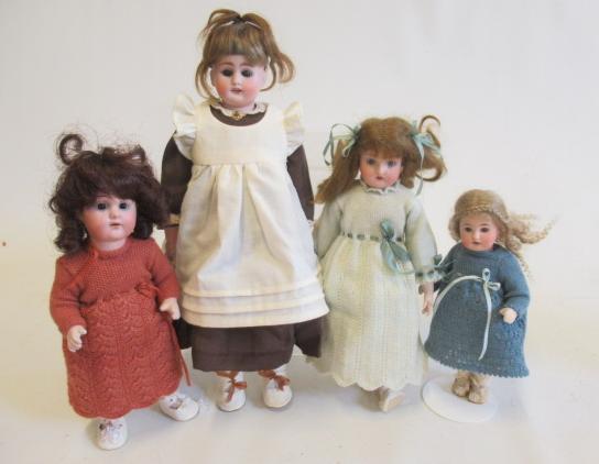 Four bisque head dolls Image