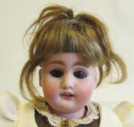 Four bisque head dolls Image