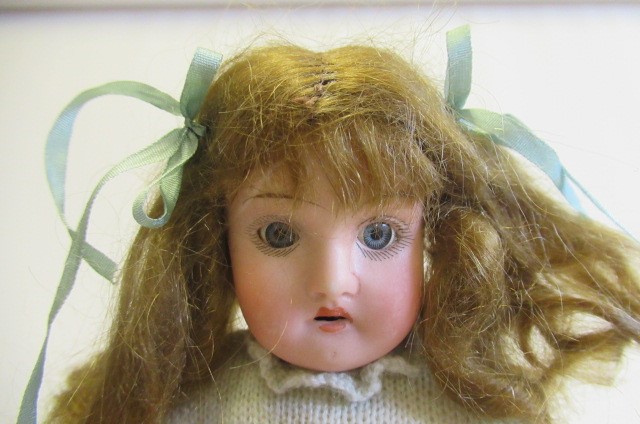 Four bisque head dolls Image