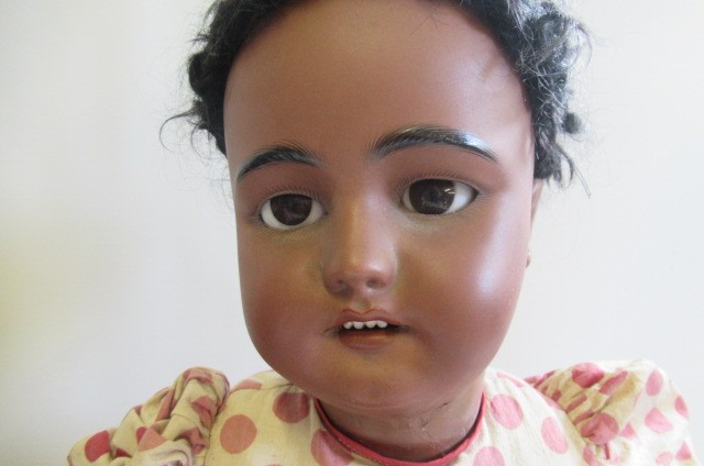 A Simon & Halbig bisque socket head mulatto doll Image