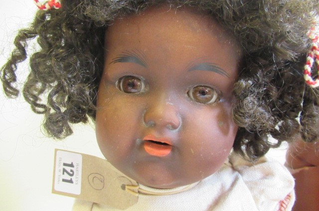 A Simon & Halbig bisque socket head mulatto doll Image
