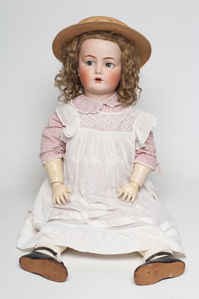 A Kammer & Reinhardt bisque socket head flirty eye doll Image