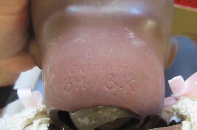 Two Armand Marseille mulatto socket head dolls Image